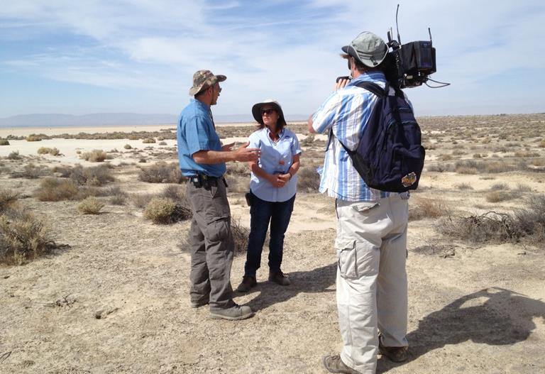  A PBS cameraman records footage of a discussion between environmental engineer Vic Etyemezian of the Desert Research Institute and NASA Dryden occupational health scientist Miriam Rodon-Naveira for a feature story on their Valley Fever research study to be aired on the PBS News Hour in June. (NASA / Beth Hagenauer)