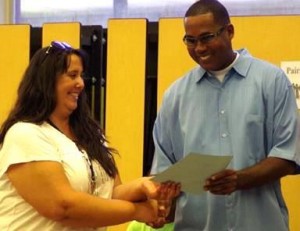 Stan Muhammad of the City of Lancaster’s Neighborhood Vitalization Commission presented each of the 16 volunteers with Appreciation Certificates.