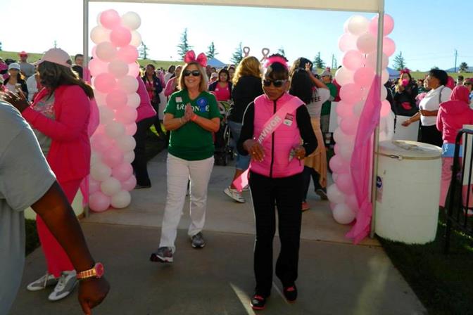 Breast cancer survivor Naima Moore (right) said the Making Strides Against Breast Cancer event brought the community together for a common cause.