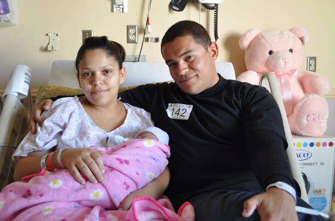 Baby Isabelle and her parents were given a new car seat and carrier, a large pink teddy bear and a gift basket filled with a variety of baby gifts. (Photo courtesy AVH)