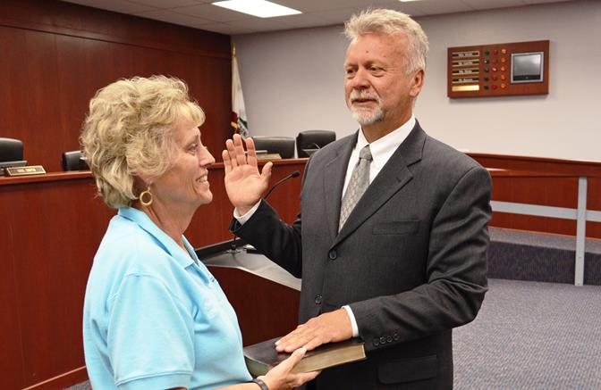 Dennis Trujillo is sworn in by Board President Nancy Smith.