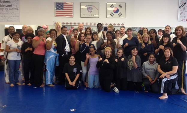 Attendees pose for a picture after completing the women’s self-defense/ holiday safety seminar in 2012. (Photo courtesy William Robinson.)