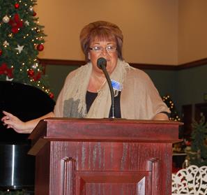 Public Affairs Director Debbie Dino announces the musical lineup at a news conference Dec. 5.