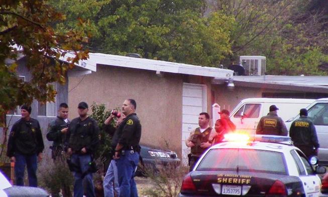 Operation Safe Streets detectives and members of the LAN-CAP Team descended on a home in the 44700 block of 3rd Street East Tuesday afternoon to look for parolee-at-large Juan Magallon. (Photo by LUIS MEZA)