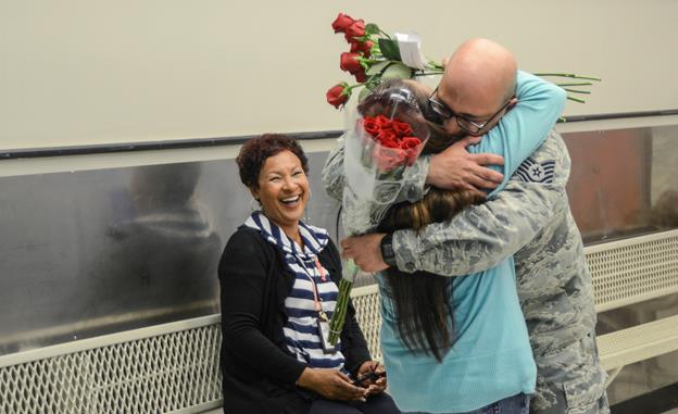 After months of separation, Tech. Sgt. Donald Martinez Jr., 31st Tests and Evaluation Squadron, reunites with his wife Araceli at the Commissary where she works as a bagger May 5. (U.S. Air Force photo by Rebecca Amber) 
