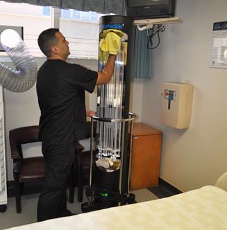 Antelope Valley Hospital Environmental Services Aid Osvaldo Dominguez preps the Surfacide tower for cleaning in a patient room. (contributed)