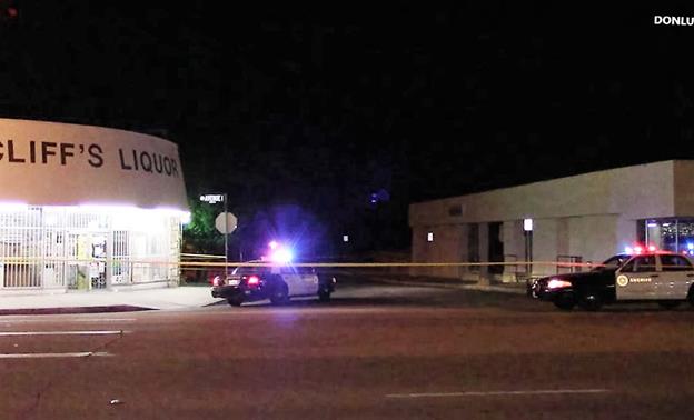 The shooting in front of Cliff's Liquor in the 1100 block of West Ave I at the intersection of Kingtree Avenue in Lancaster. [Photo by LUIS MEZA]