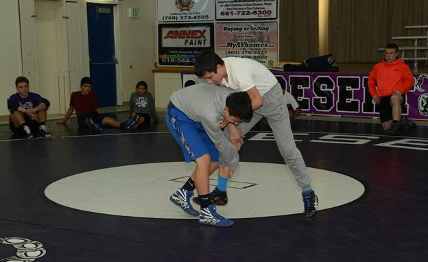 The Desert High Scorpions varsity wrestling team is able to compete for another year thanks to the volunteer efforts of this year’s six coaches. (U.S. Air Force photo by Rebecca Amber)