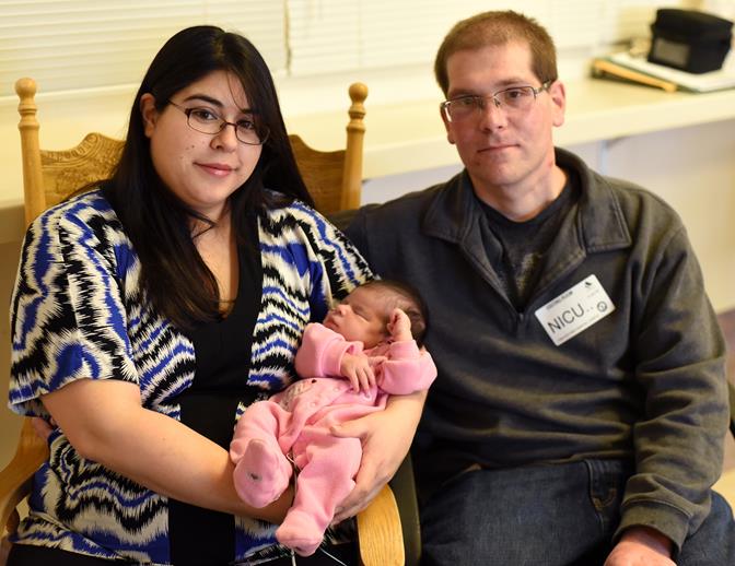 Parents, Erica and Steven Lockshin, spend time in the AV Hospital NICU with baby Isabel. [contributed]